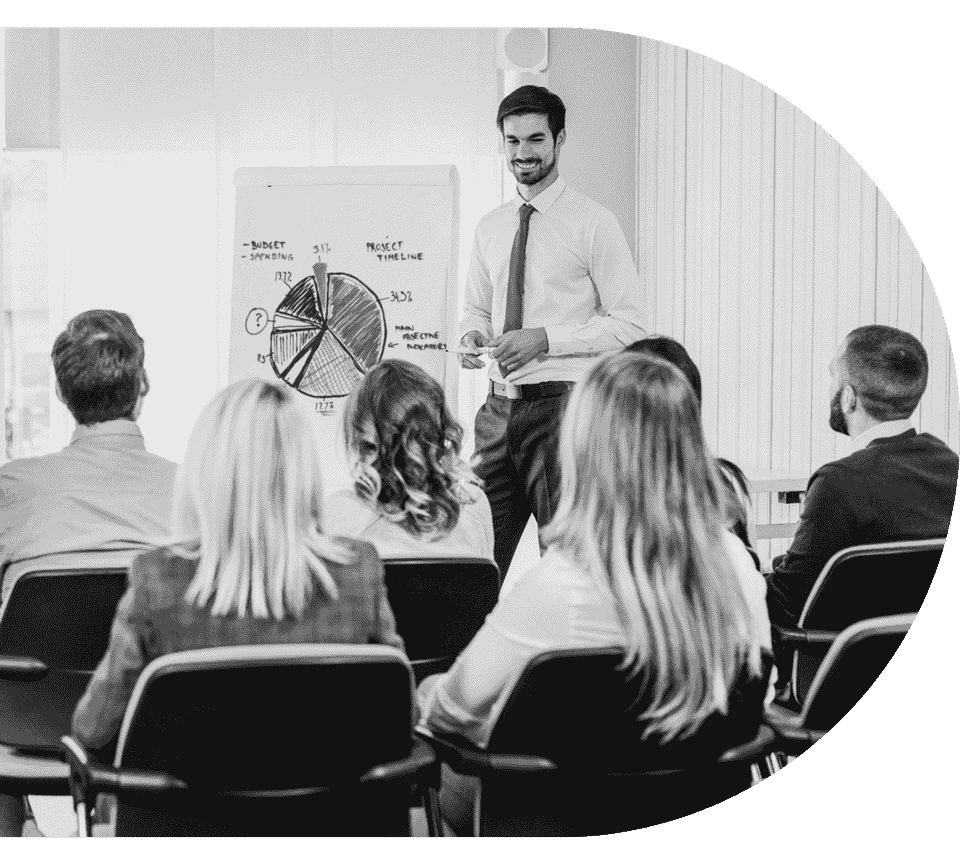 a trainer conducting a training session with a classroom of students